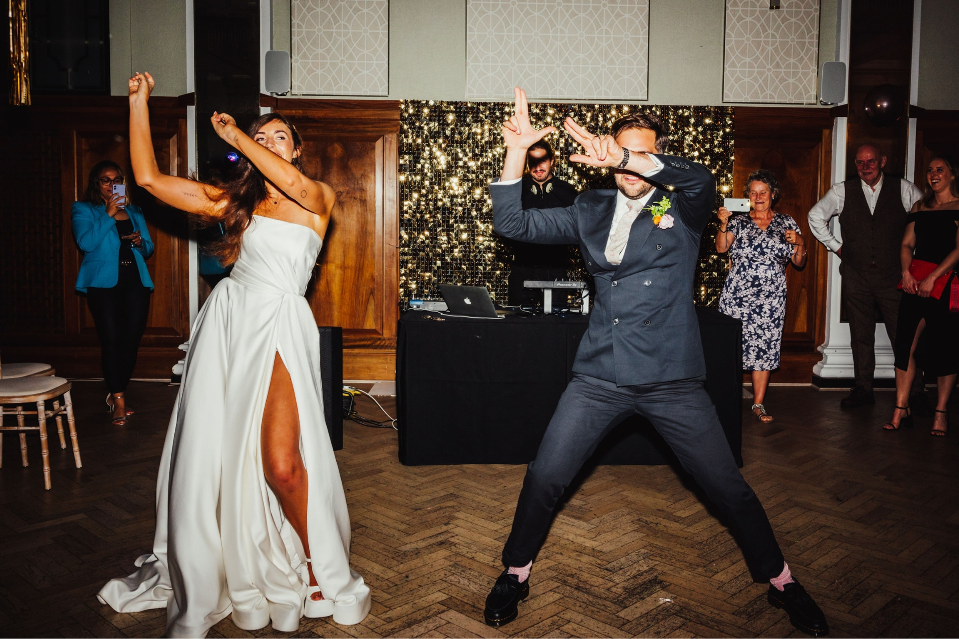 Bride and groom dancing at Pelham House wedding venue with analogue wedding photography trend 2024