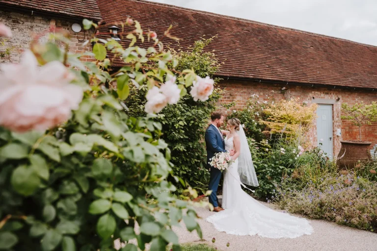 couple outside by a rose tree