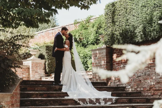 braxted park couple kissing on garden steps