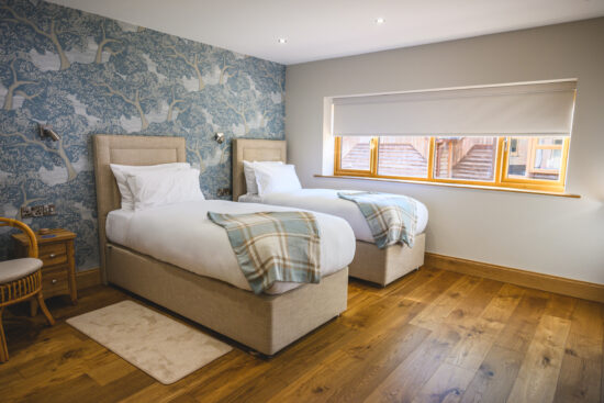 A Twin Guest Bedroom at Rivervale Lodge wedding accommodation in Hampshire