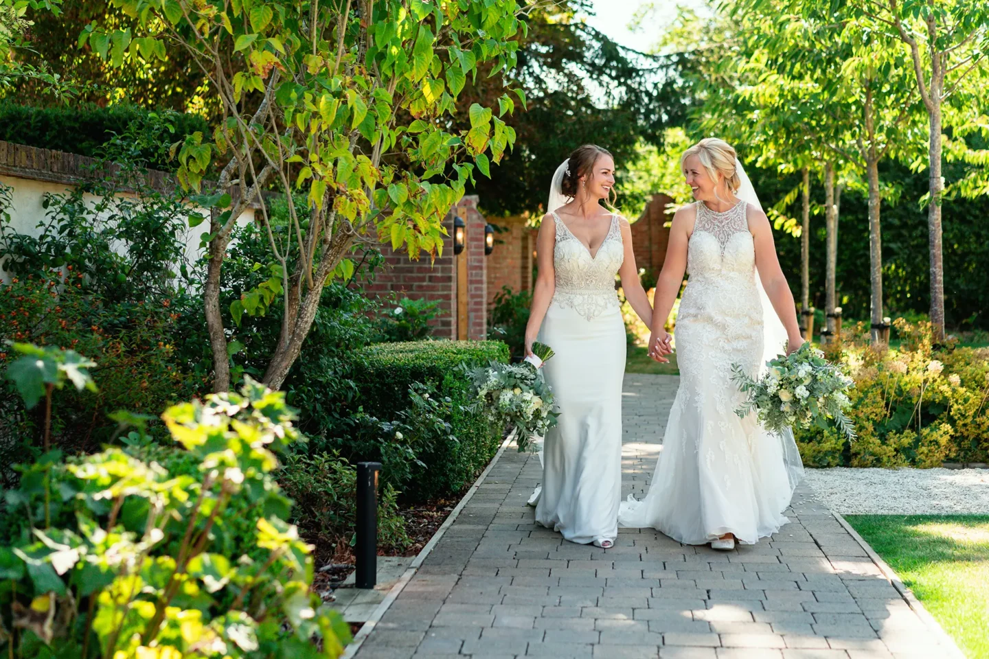 Syrencot brides walking in gardens