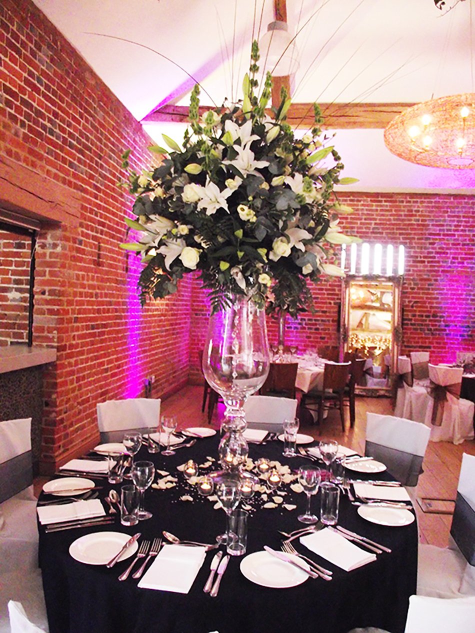 Bling up your barn wedding venue with large floral table centrepieces