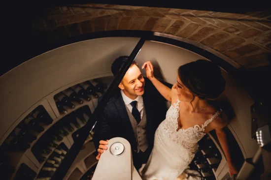 bride and groom in the wine cellar