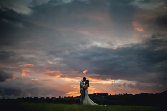 bride and groom outdoors at sunset at crumplebury
