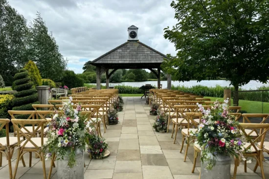 An outdoor ceremony set up at Sandhole Oak Barn wedding venue in Cheshire