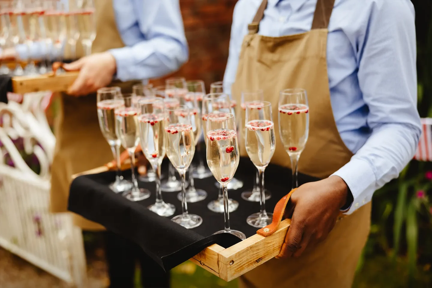 Champagne is served at a drinks reception at Sandhole Oak Barn in Cheshire
