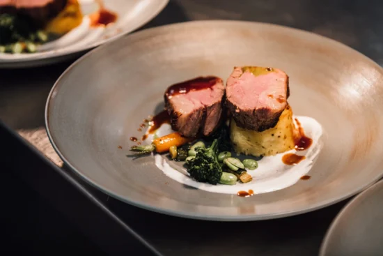 A lamb main course is served for a wedding breakfast at this Cheshire Wedding Venue
