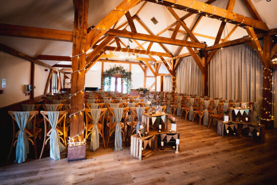 The oak barn at Sandhole Oak Barn wedding venue in Cheshire set up for a wedding ceremony