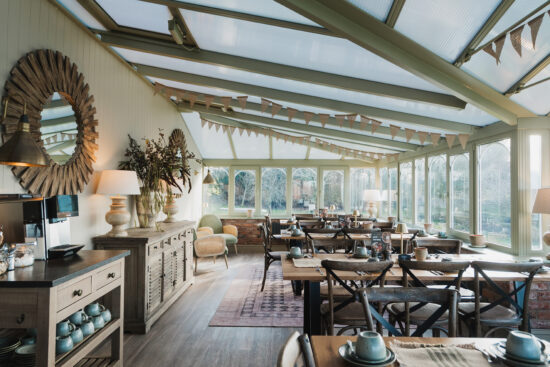 Conservatory breakfast dining at Sandhole Oak Barn Cheshire wedding venue