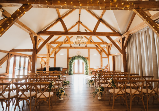 The oak barn at Sandhole Oak Barn wedding venue in Cheshire set up for a wedding ceremony