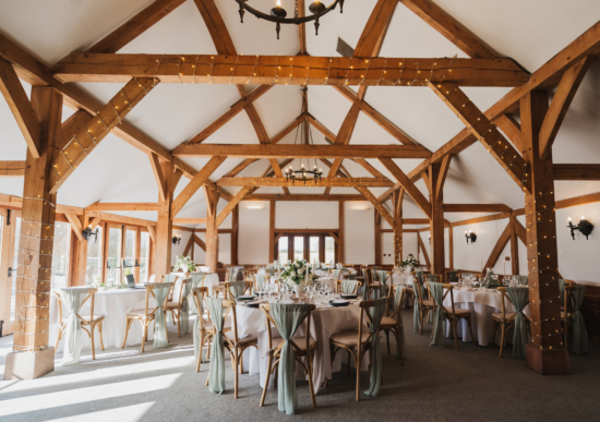 A wedding reception set up at Sandhole Oak Barn wedding venue in Cheshire