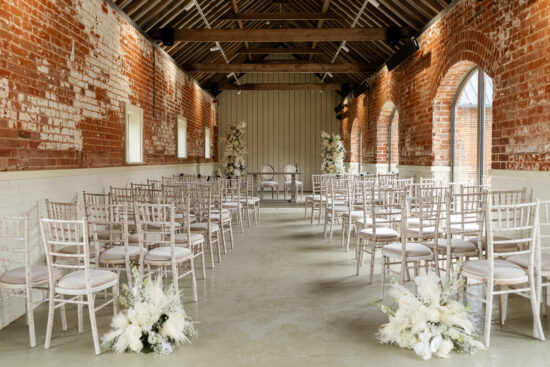 A wedding ceremony set up for a white wedding at Branches Park