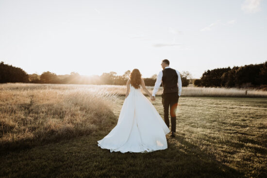 A bride and groom in the Suffolk Countryside at Branches Park
